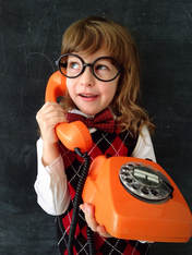 Little Girl on Orange Phone
