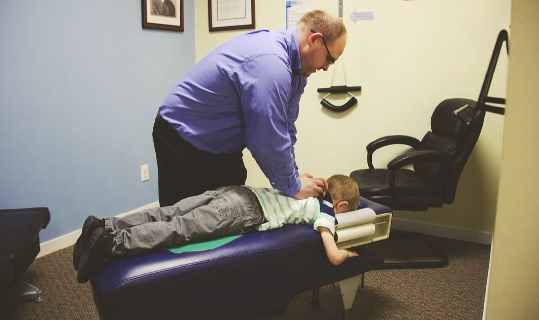 Dr. Matt using Chiropractic on a Child